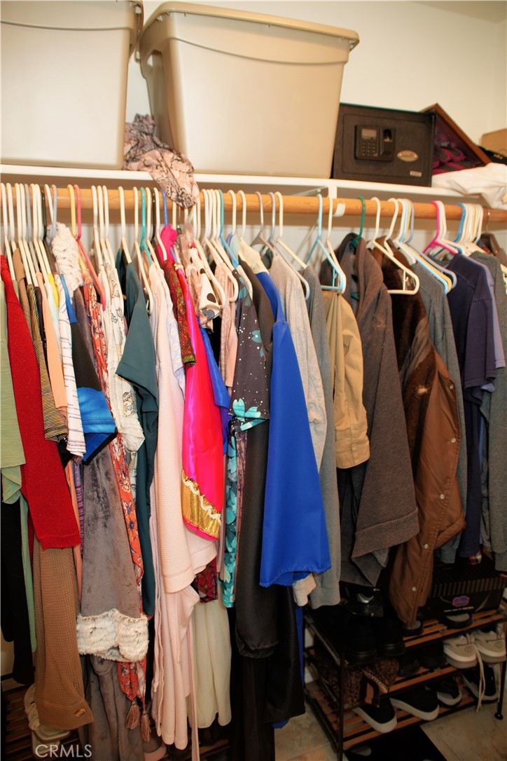 6431 Cathay Circle Buena Park, CA 90620 - Photo 41 of 65 a view of walk in closet with clothes and shoes