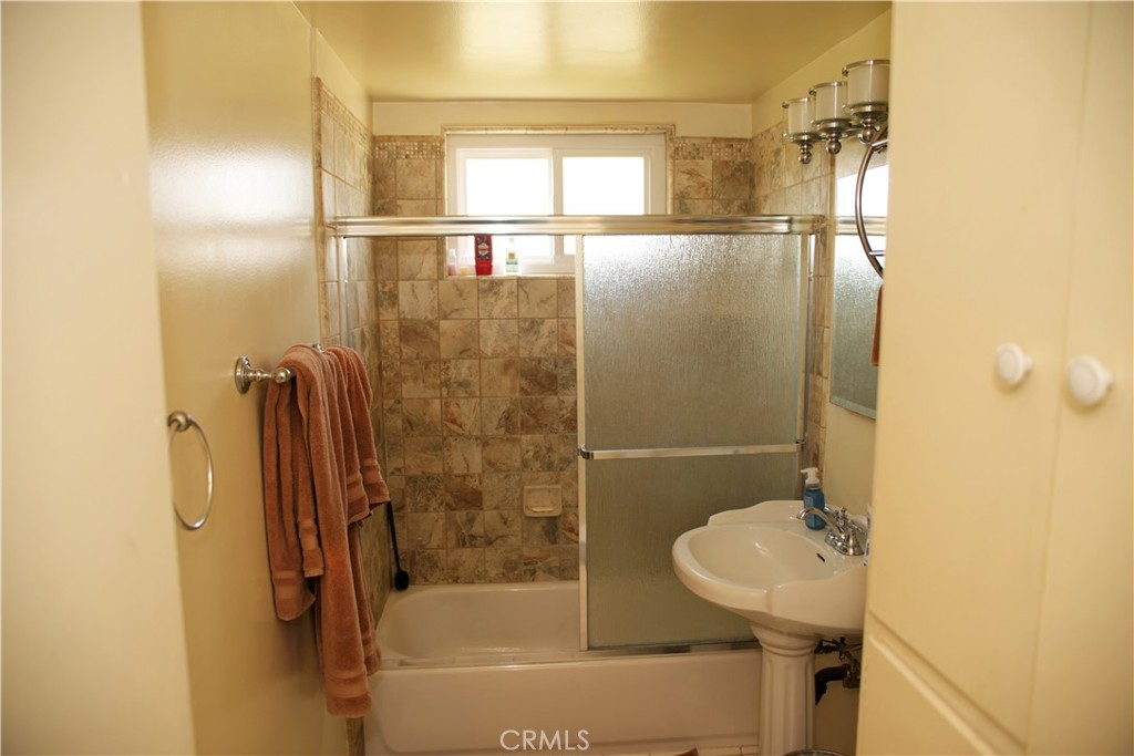 6431 Cathay Circle Buena Park, CA 90620 - Photo 44 of 65 a bathroom with a shower and a sink