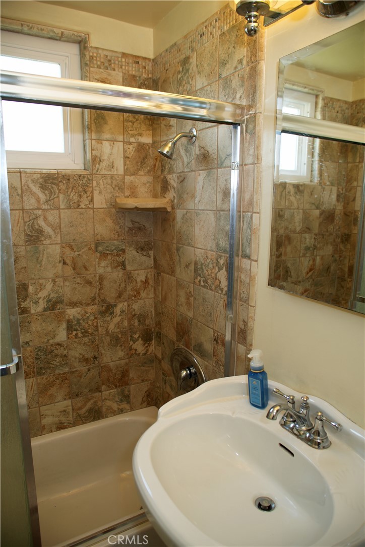 6431 Cathay Circle Buena Park, CA 90620 - Photo 50 of 65 a bathroom with a sink and a shower