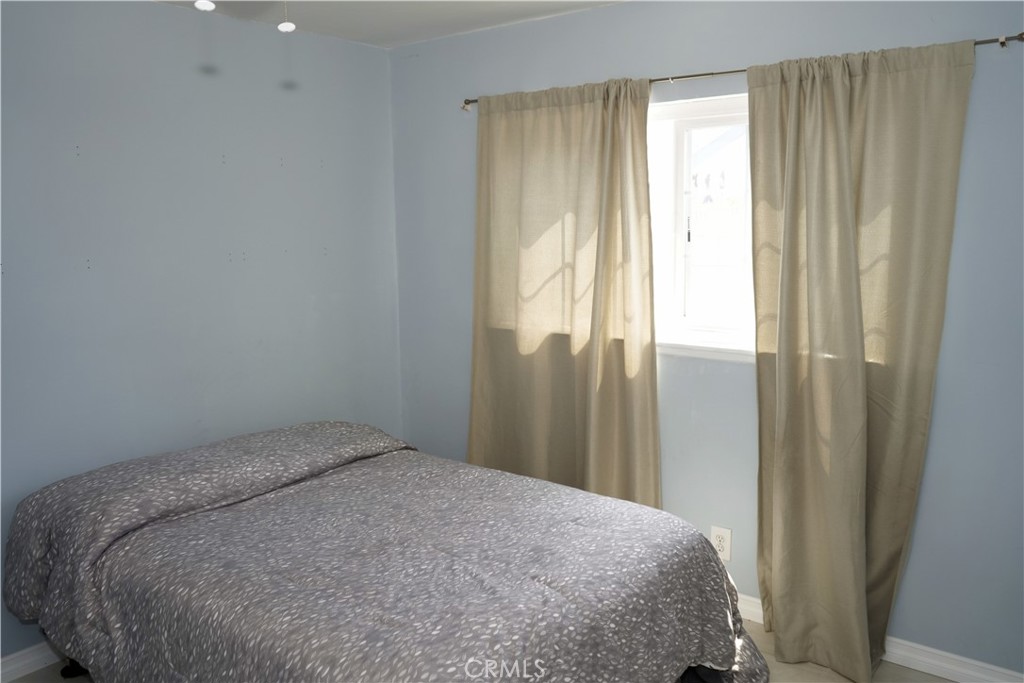 6431 Cathay Circle Buena Park, CA 90620 - Photo 52 of 65 a bed sitting in a bedroom next to a window