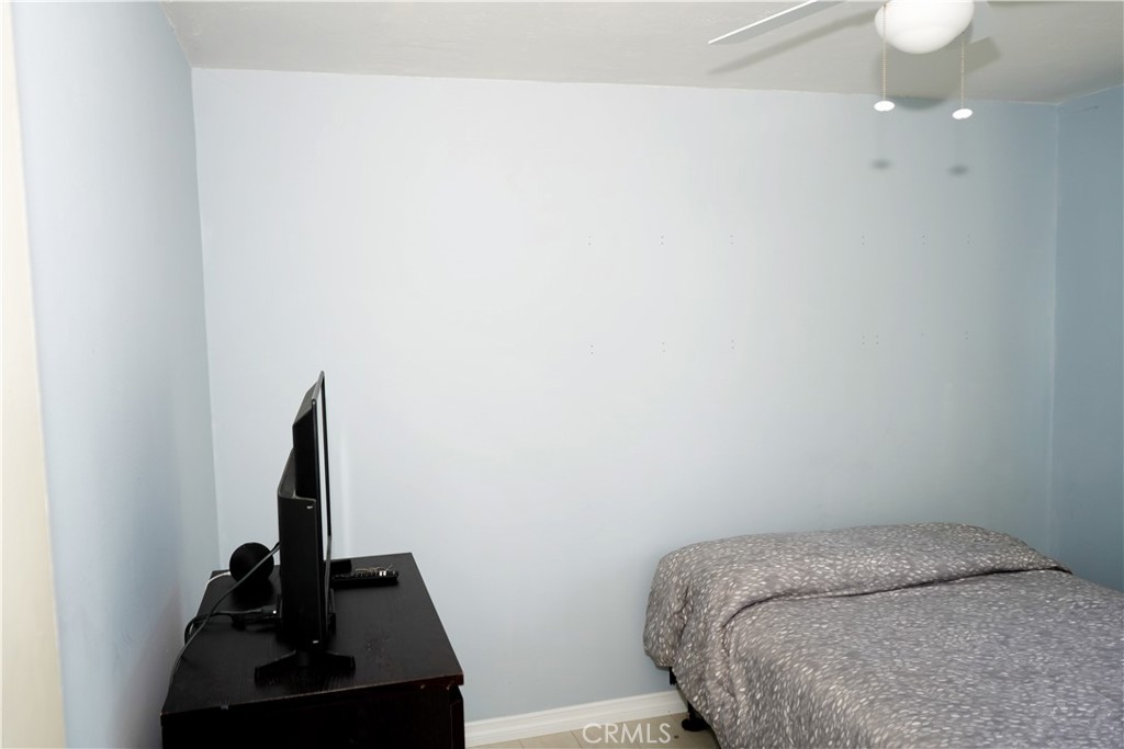 6431 Cathay Circle Buena Park, CA 90620 - Photo 53 of 65 a bedroom with a bed and a window