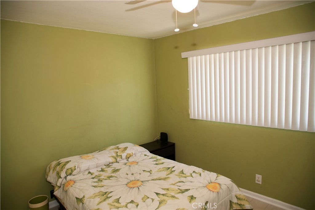 6431 Cathay Circle Buena Park, CA 90620 - Photo 57 of 65 a bedroom with a bed and a window