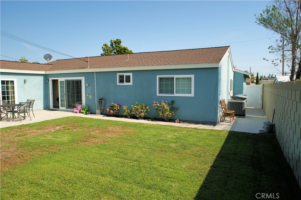 6431 Cathay Circle Buena Park, CA 90620 - Photo 8 of 65 View from left rear looking to the left side of the home show a large grass area to enjoy.