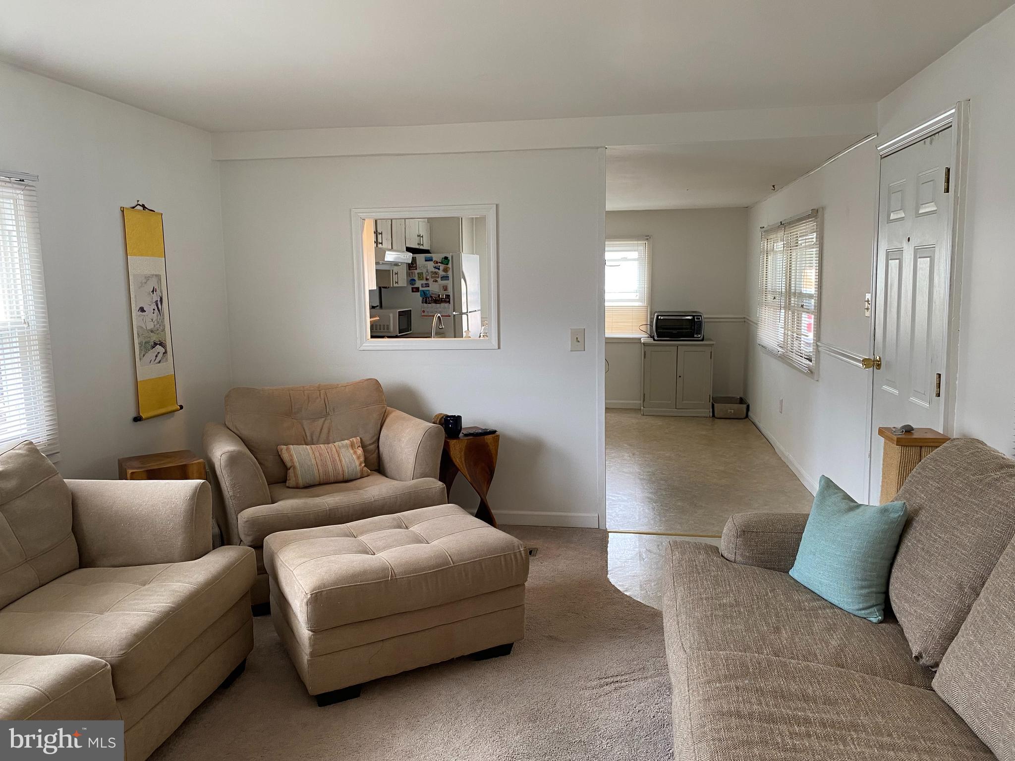 46 Jones Mill Road, Unit 104 Wrightstown, NJ 08562 - Photo 5 of 11 a living room with furniture and a couch