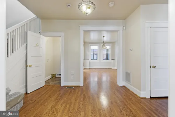 a view of livingroom with hardwood floor and hallway
