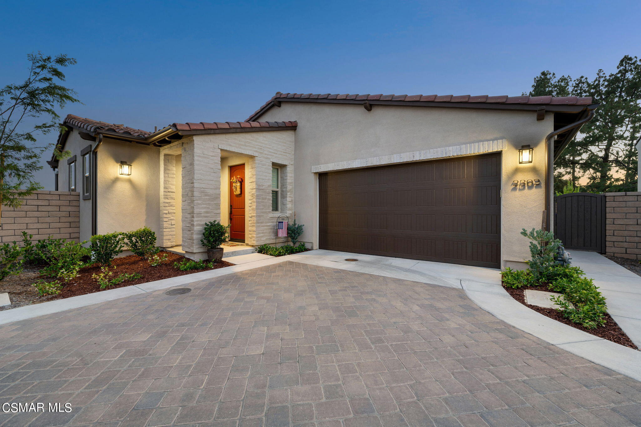2392 Rondell Road Camarillo, CA 93012 - Photo 2 of 81 a view of a house with a yard and garage
