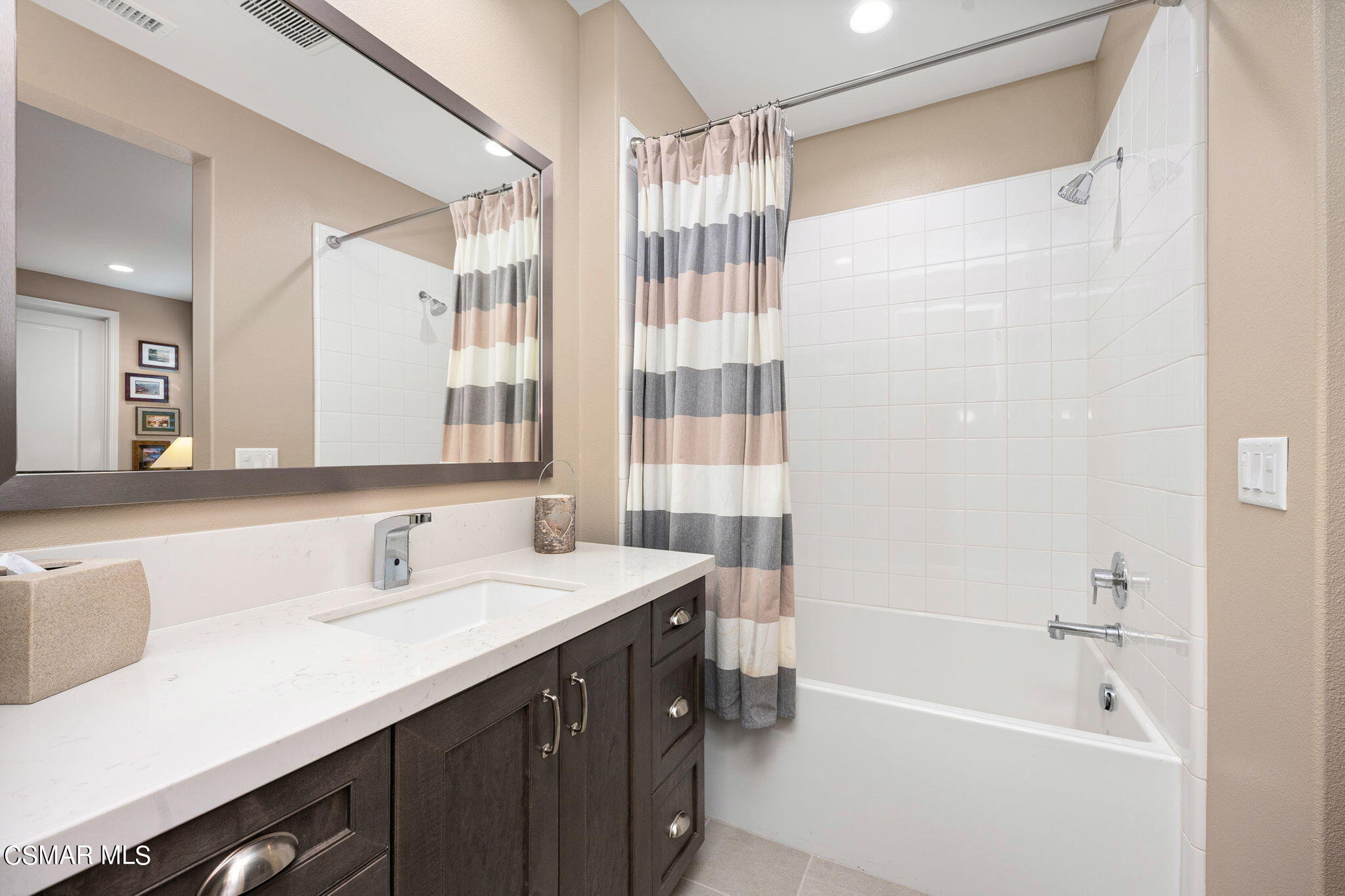 2392 Rondell Road Camarillo, CA 93012 - Photo 45 of 81 a bathroom with a tub sink and mirror