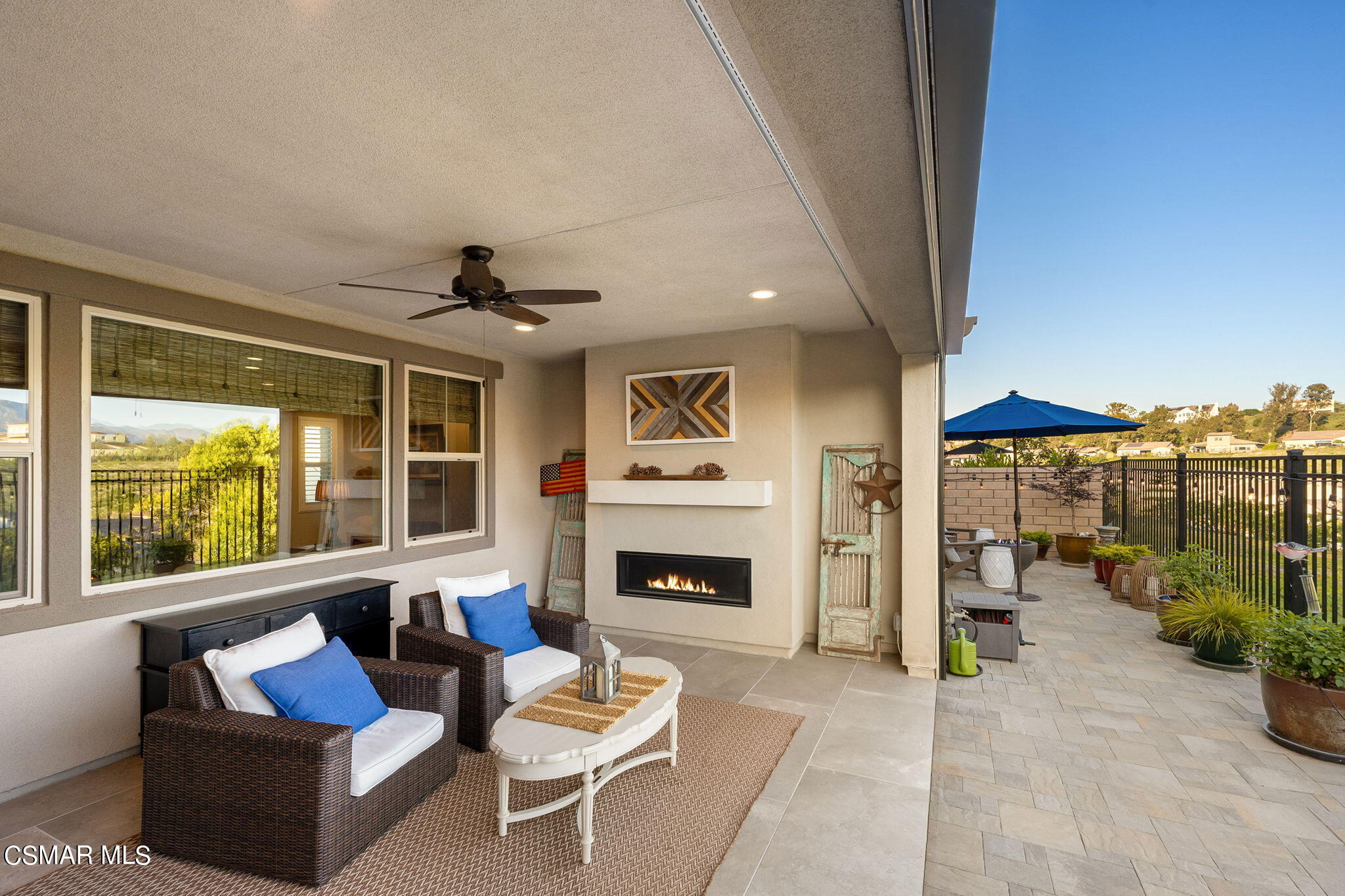 2392 Rondell Road Camarillo, CA 93012 - Photo 48 of 81 a living room with furniture fireplace and a large window