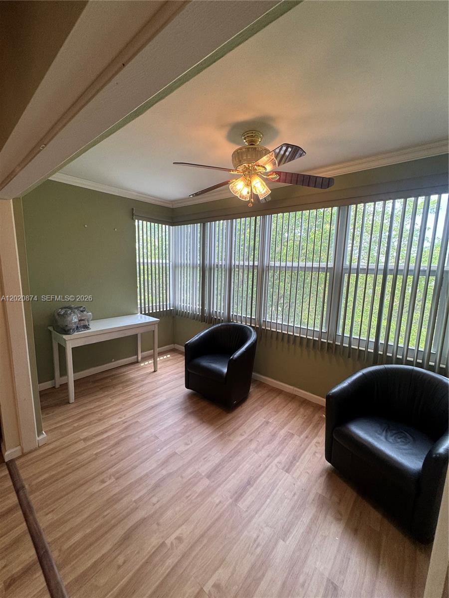 6731 Cypress Road, Unit 410 Plantation, FL 33317 - Photo 14 of 15 a living room with furniture and a large window