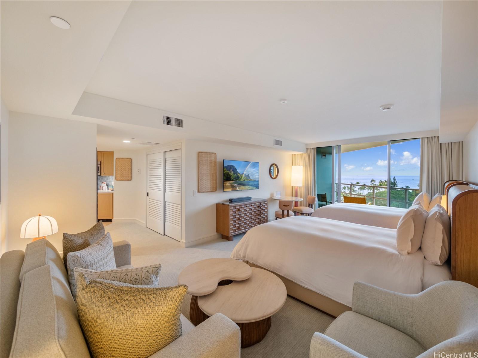 223 Saratoga Road, Unit 1105 Honolulu, HI 96815 - Photo 2 of 14 a living room with furniture and a large window