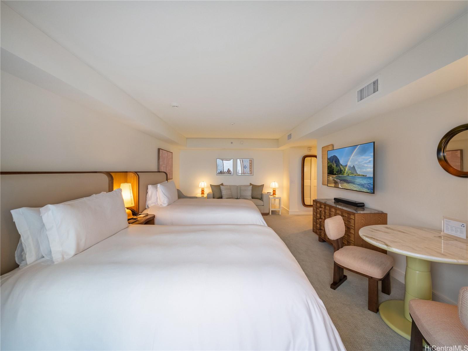 223 Saratoga Road, Unit 1105 Honolulu, HI 96815 - Photo 4 of 14 a bedroom with a bed and window