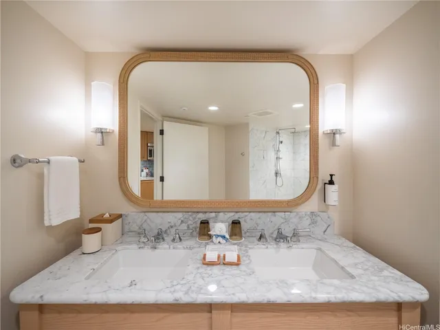 a bathroom with sinks mirror and vanity