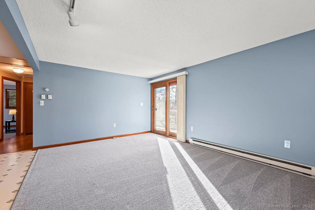 15 Deepwood Road Stafford, CT 06076 - Photo 11 of 30 a view of an empty room with glass door