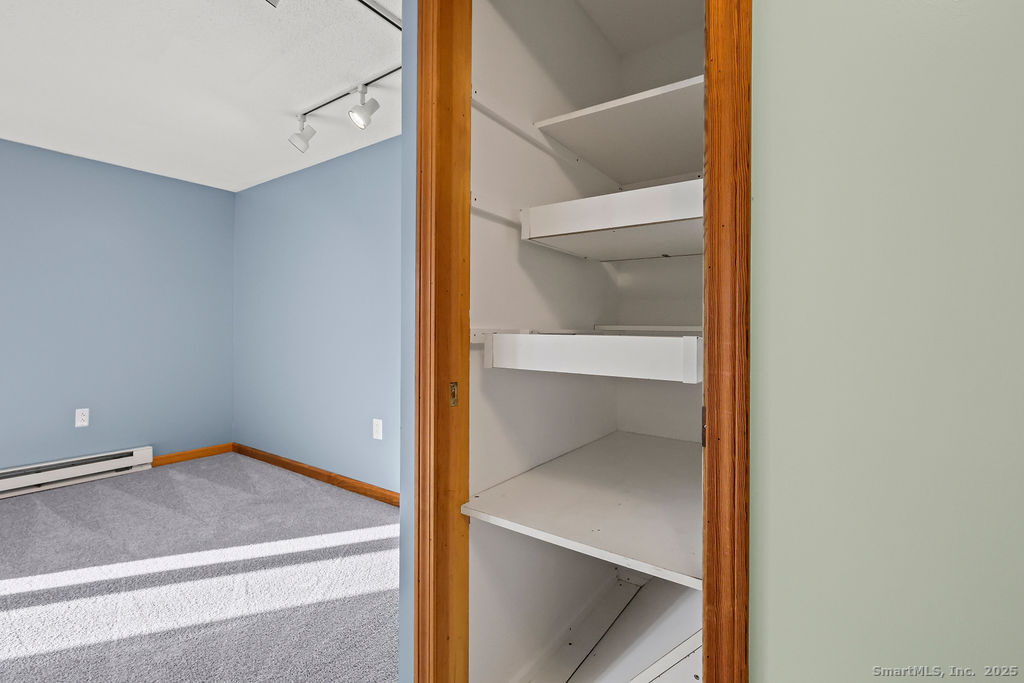 15 Deepwood Road Stafford, CT 06076 - Photo 16 of 30 a view of an empty walk in closet