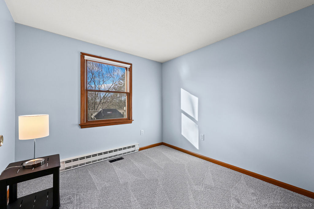 15 Deepwood Road Stafford, CT 06076 - Photo 21 of 30 a view of an empty room with a window