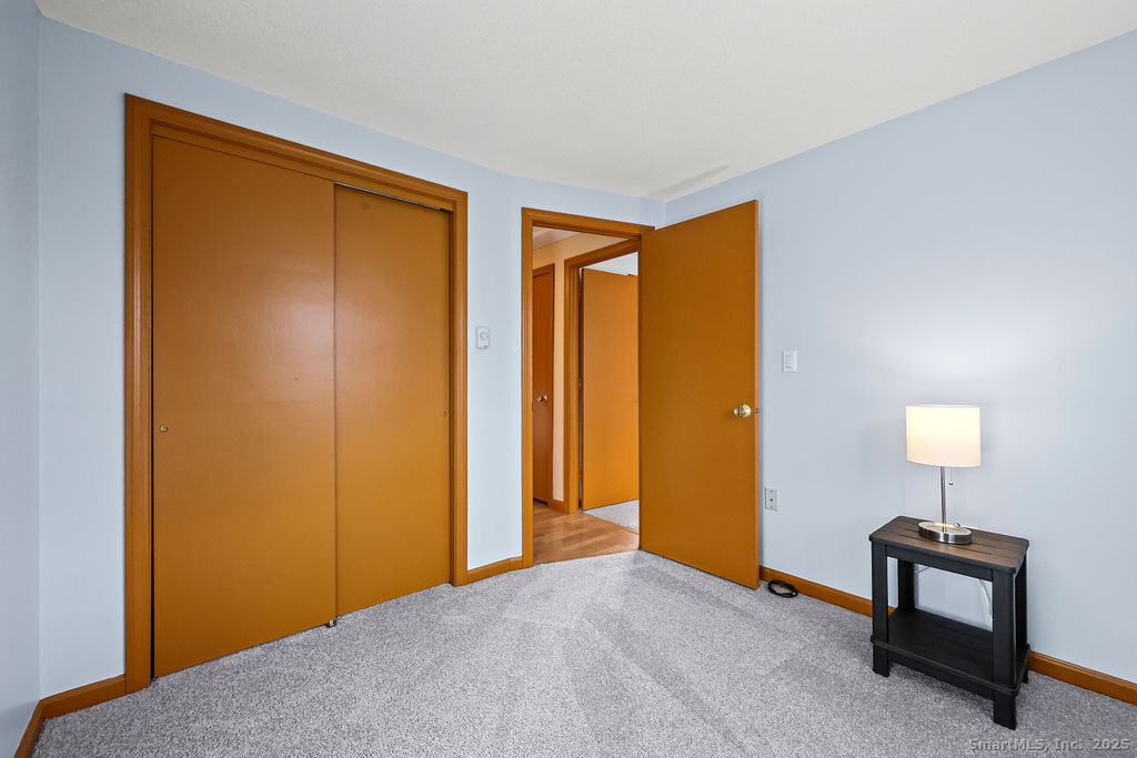 15 Deepwood Road Stafford, CT 06076 - Photo 22 of 30 a view of an empty room with window and a livingroom