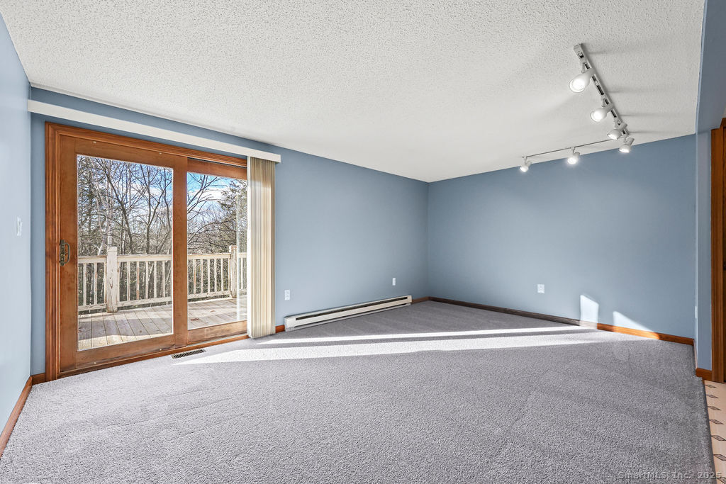 15 Deepwood Road Stafford, CT 06076 - Photo 8 of 30 a view of an empty room with a window