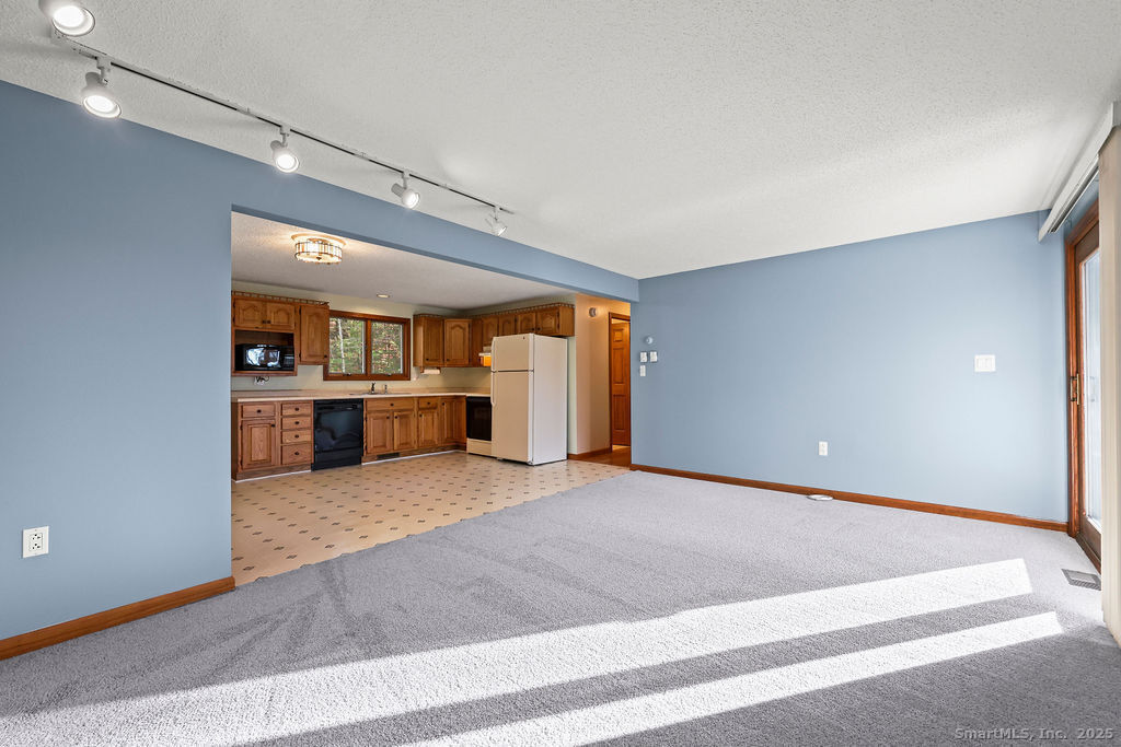 15 Deepwood Road Stafford, CT 06076 - Photo 9 of 30 a view of a kitchen with a sink and a kitchen
