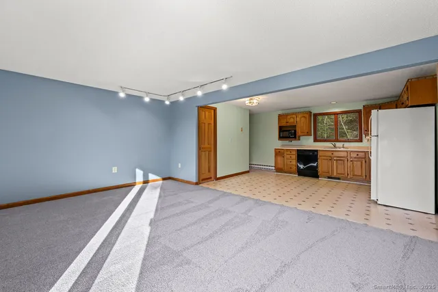 a view of an empty room with glass door