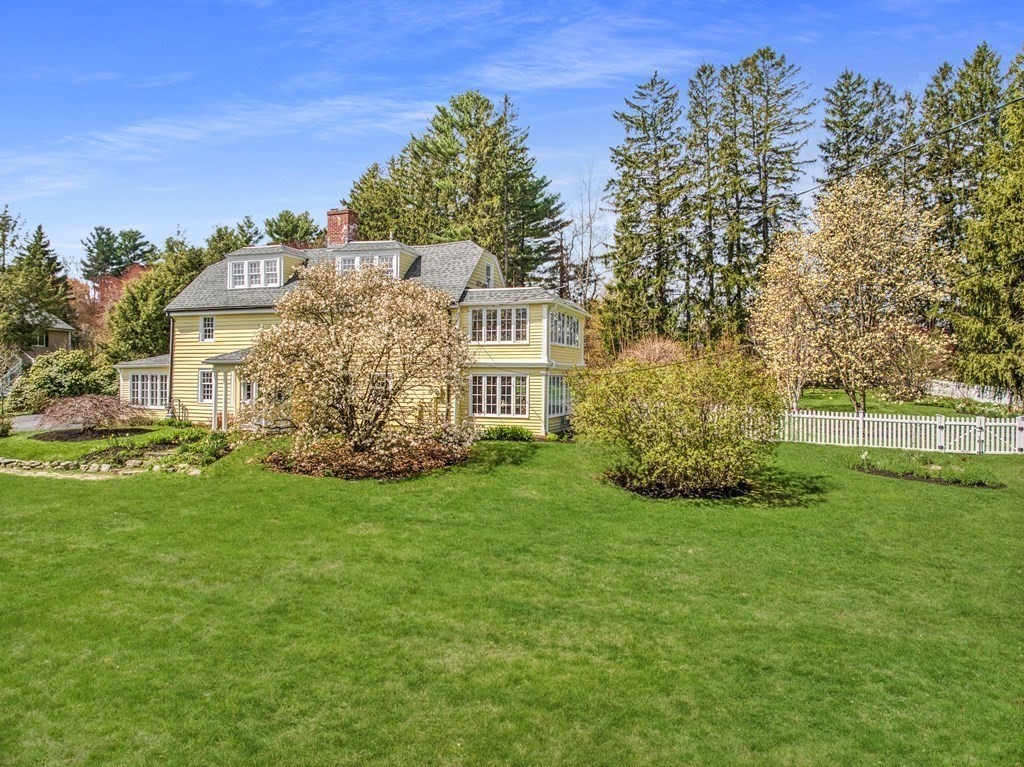 101 Holt Road Andover, MA 01810 - Photo 5 of 38 a view of a big house with a big yard plants and large trees