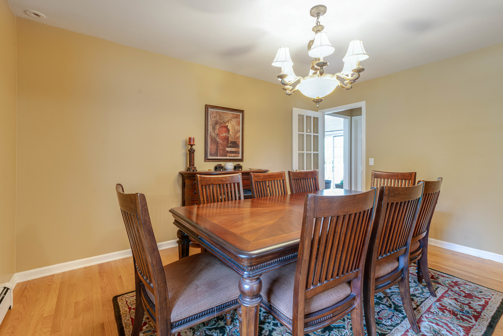 357 Roberts Road Inverness, IL 60010 - Photo 12 of 50 a view of a dining room with furniture and a chandelier