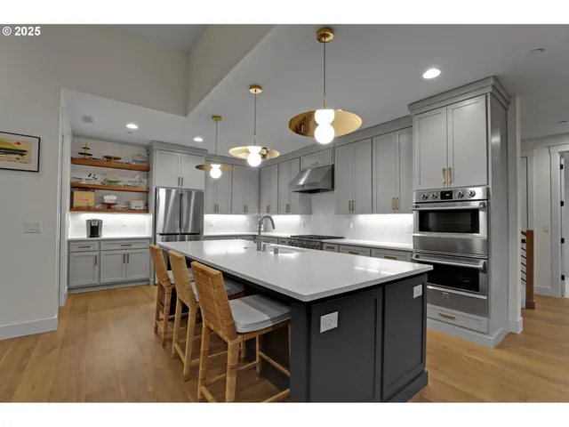 a kitchen with a table and chairs in it