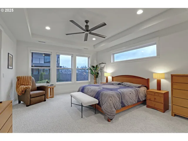 a bedroom with a bed couch and window