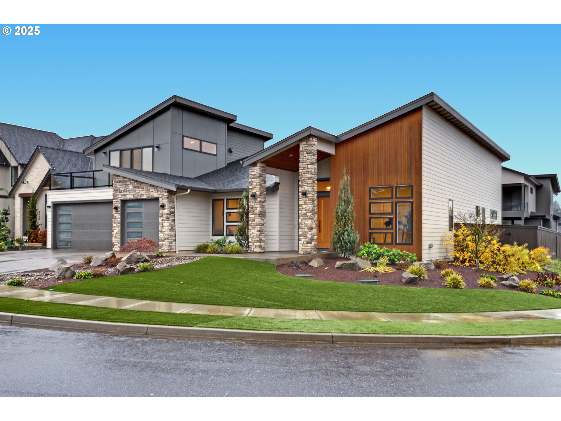 4336 Northwest Paddock Lane Camas, WA 98607 - Photo 2 of 39 a front view of a house with a yard