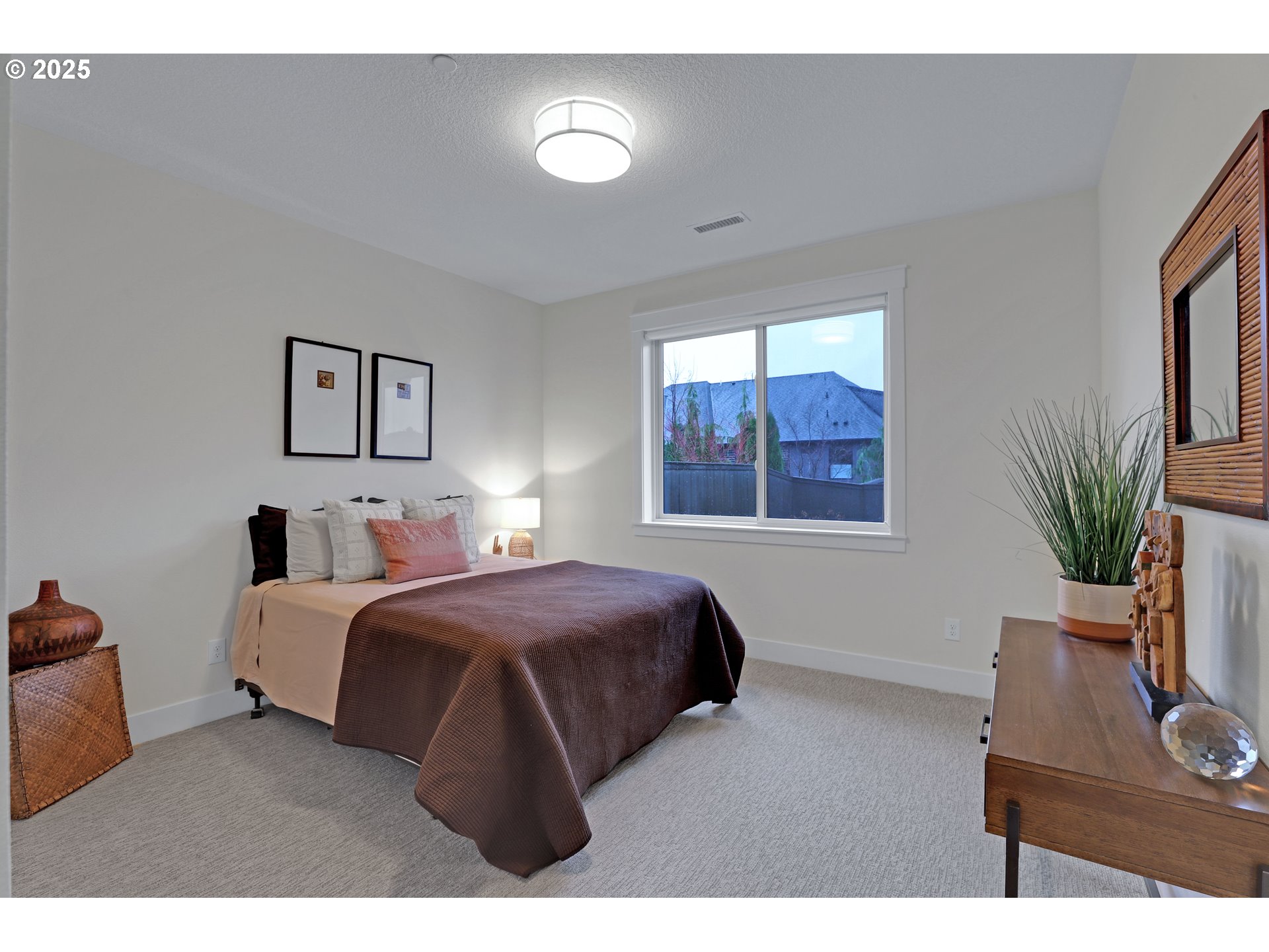 4336 Northwest Paddock Lane Camas, WA 98607 - Photo 25 of 39 a bedroom with a large bed and a window