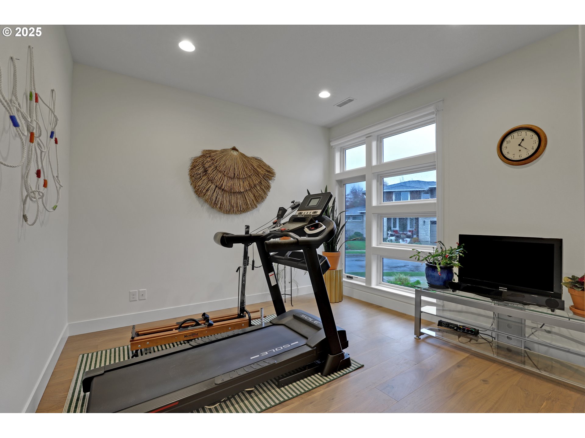 4336 Northwest Paddock Lane Camas, WA 98607 - Photo 29 of 39 a room with gym equipment and a flat screen tv