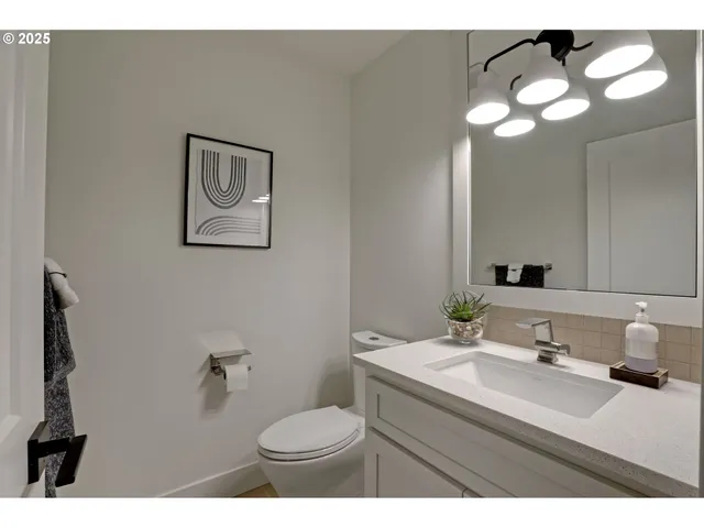 a bathroom with a sink vanity and a mirror
