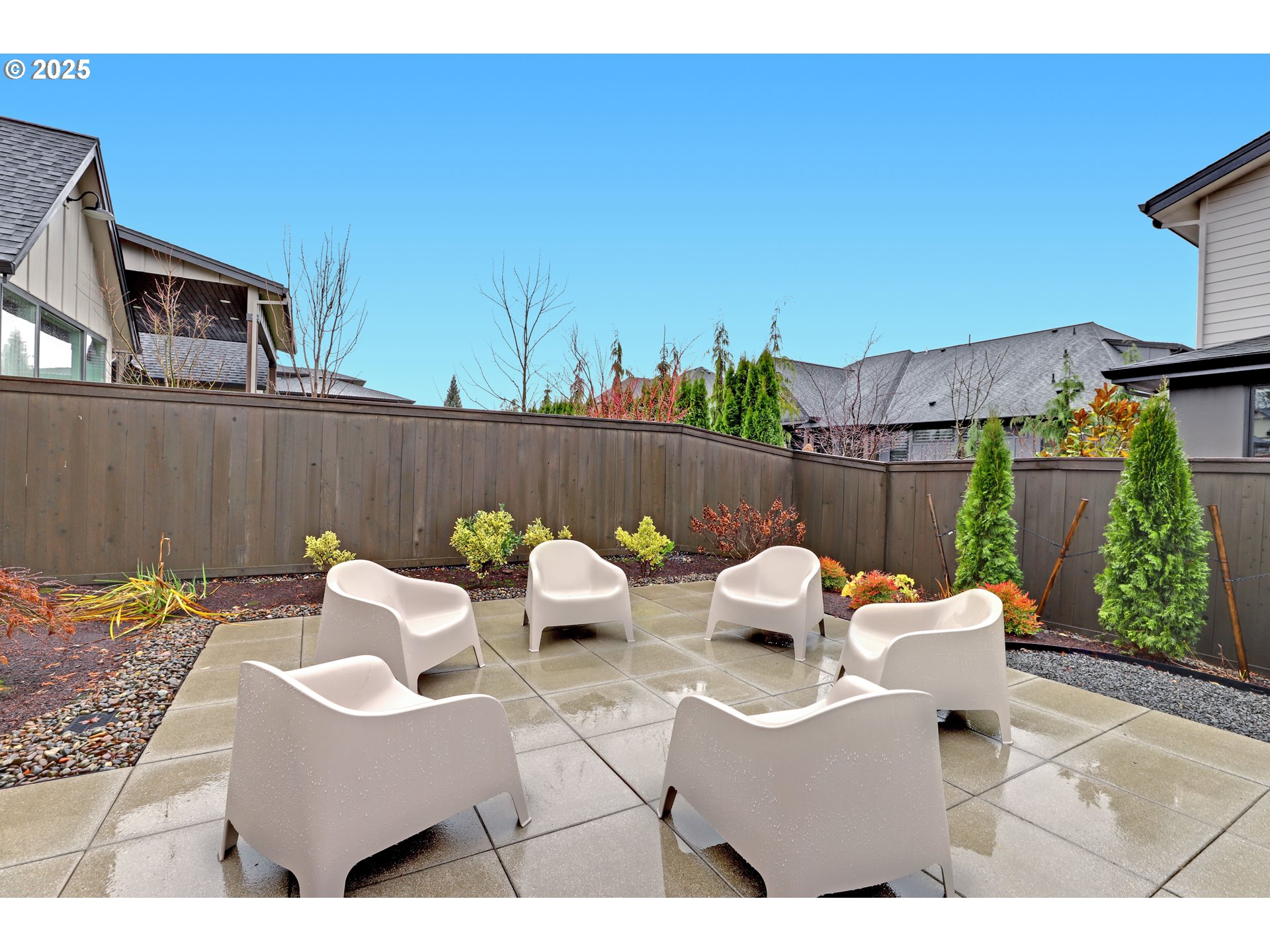 4336 Northwest Paddock Lane Camas, WA 98607 - Photo 34 of 39 a view of a patio with a table and chairs and potted plants