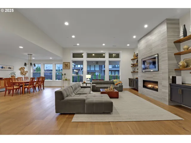 a living room with fireplace furniture and a flat screen tv