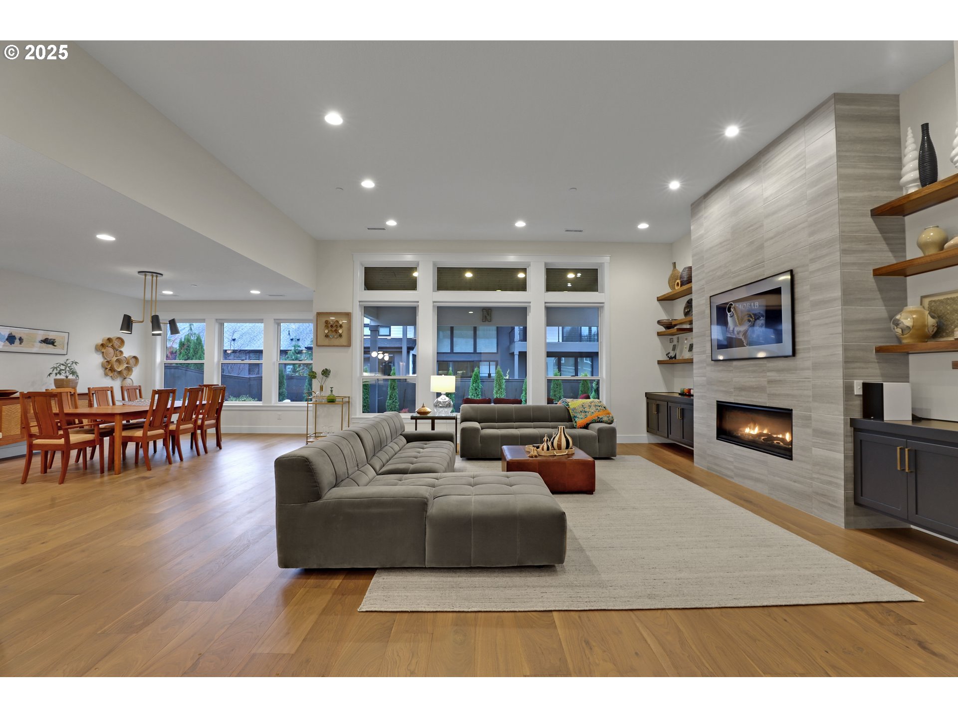 4336 Northwest Paddock Lane Camas, WA 98607 - Photo 6 of 39 a living room with fireplace furniture and a flat screen tv
