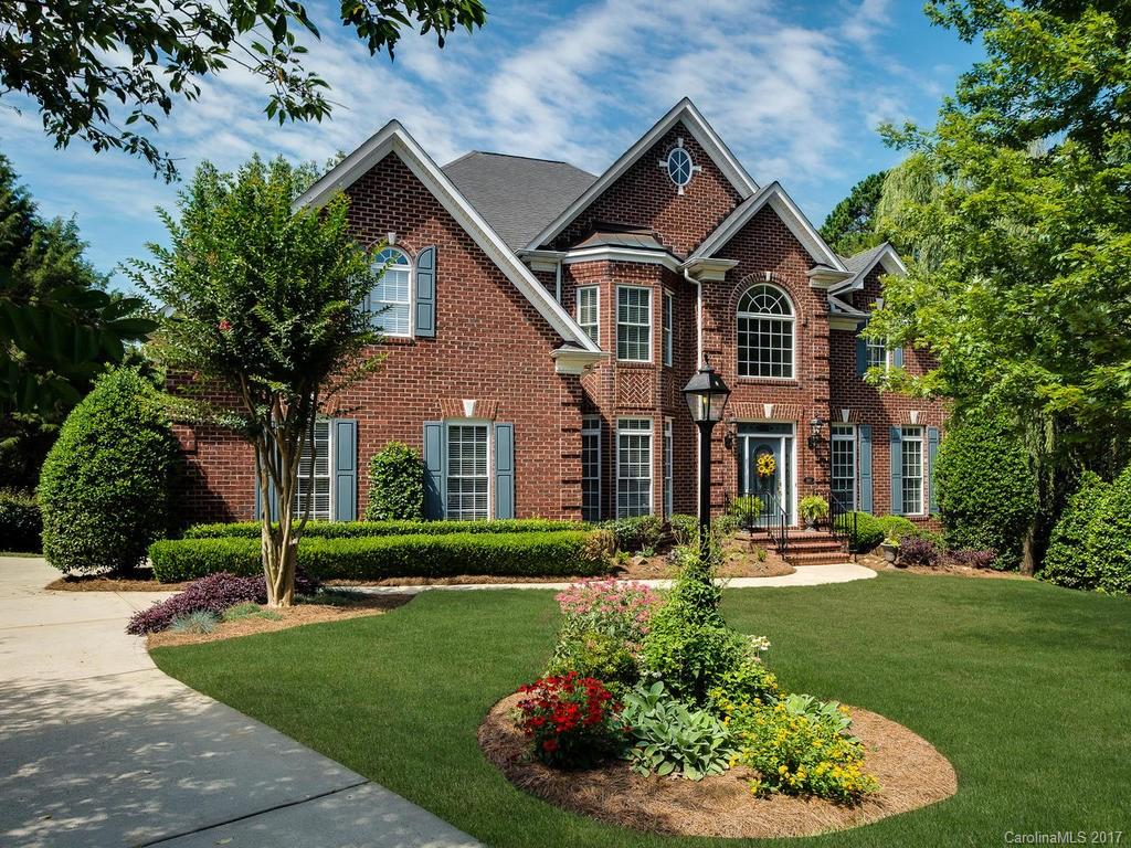 3247 Planters Ridge Road Charlotte, NC 28270 - Photo 1 of 24 a front view of a house with a yard and green space
