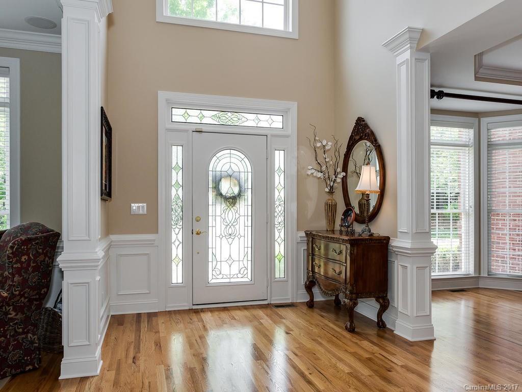3247 Planters Ridge Road Charlotte, NC 28270 - Photo 2 of 24 a view of a livingroom with furniture and a mirror