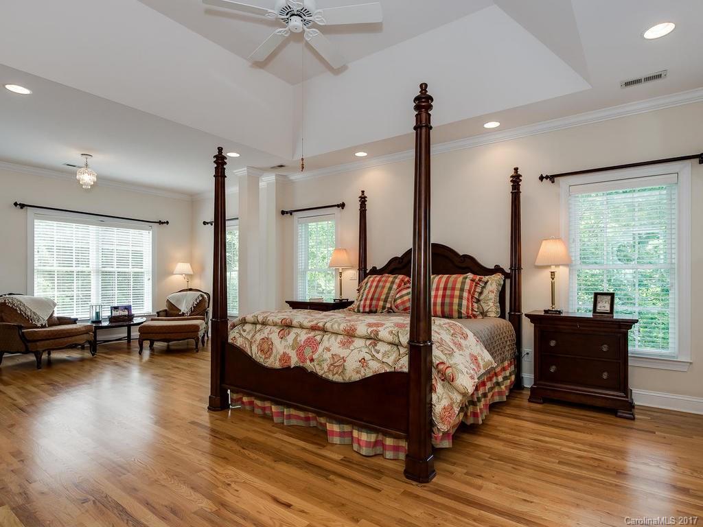 3247 Planters Ridge Road Charlotte, NC 28270 - Photo 12 of 24 a bedroom with a bed couch and a large window