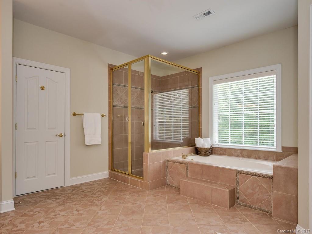 3247 Planters Ridge Road Charlotte, NC 28270 - Photo 14 of 24 a spacious bedroom with a bed and a window