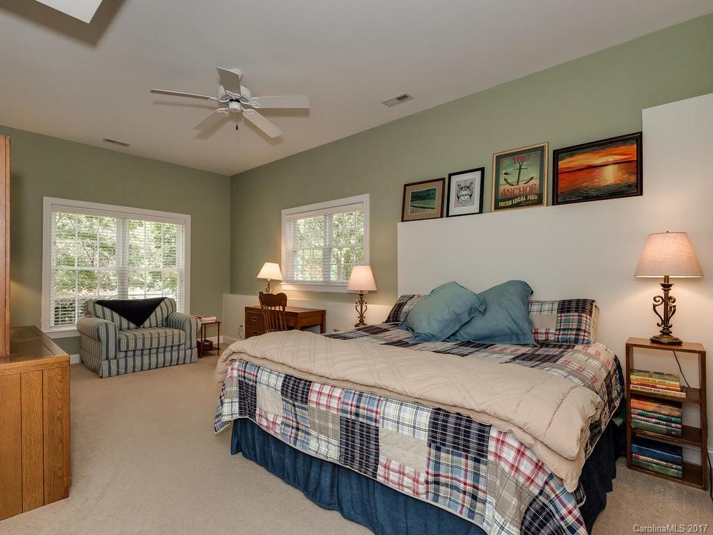 3247 Planters Ridge Road Charlotte, NC 28270 - Photo 20 of 24 a bedroom with a bed and a chandelier