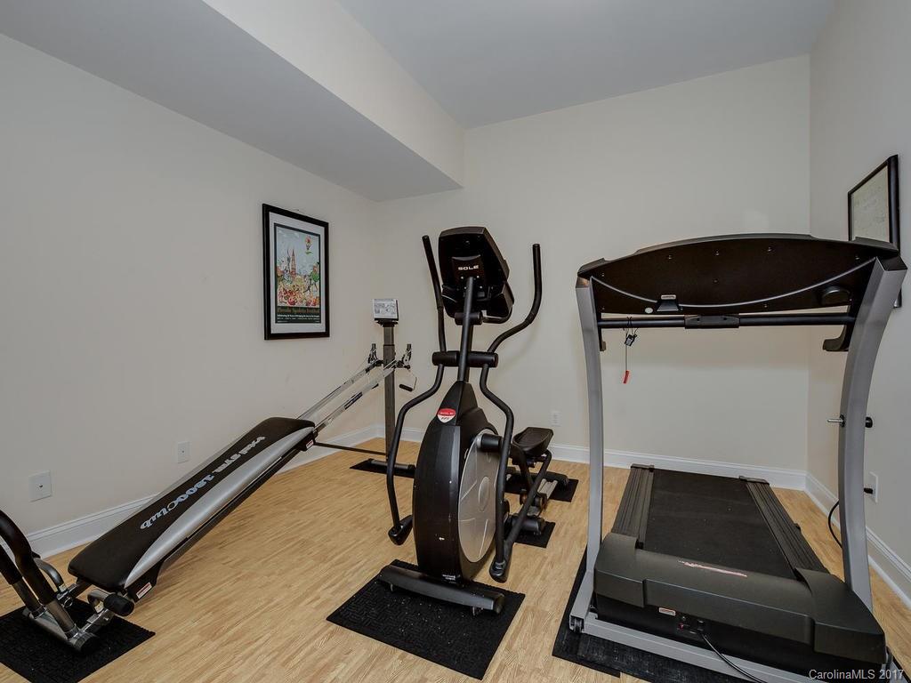 3247 Planters Ridge Road Charlotte, NC 28270 - Photo 21 of 24 a room with gym equipment and wooden floor