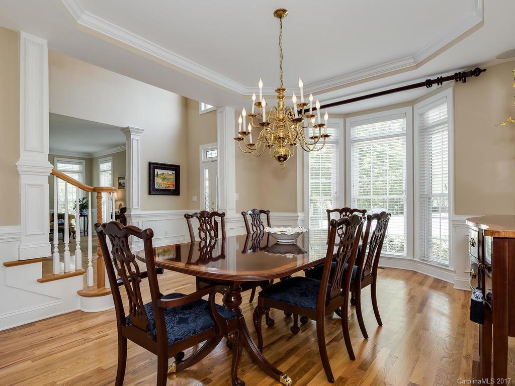 3247 Planters Ridge Road Charlotte, NC 28270 - Photo 4 of 24 a view of a dining room with furniture window and wooden floor