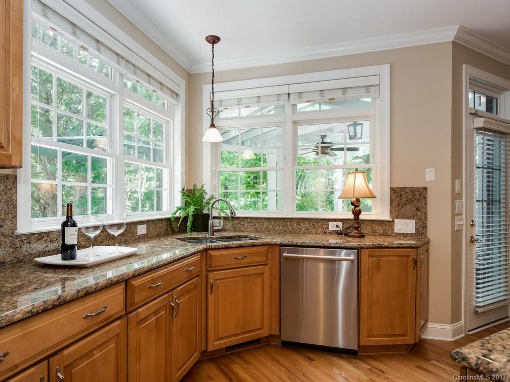 3247 Planters Ridge Road Charlotte, NC 28270 - Photo 9 of 24 a kitchen with stainless steel appliances granite countertop a sink and a window