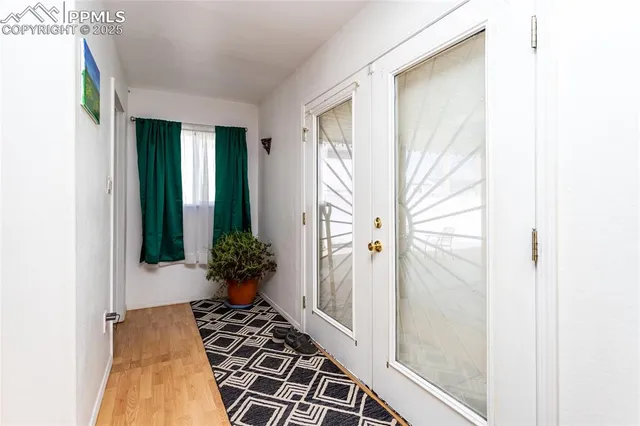 a room with stainless steel appliances a lot of clutter