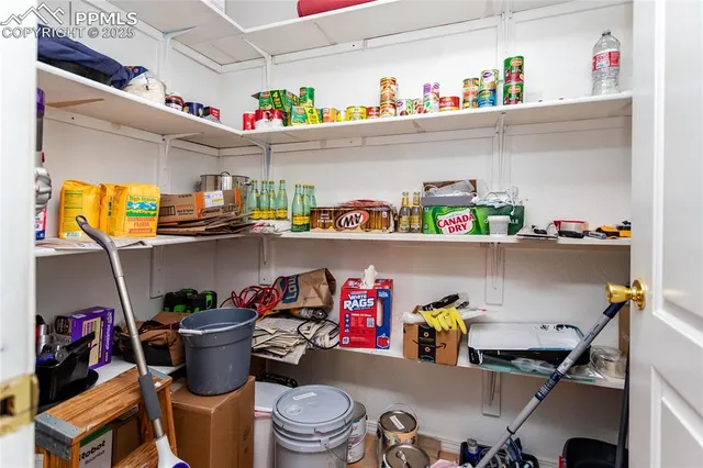 a bed room with a bed and a chandelier