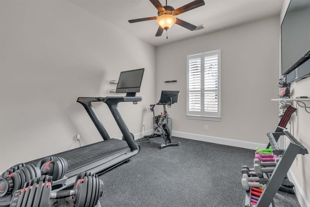 960 Packsaddle Trail Prosper, TX 75078 - Photo 17 of 40 a view of a room with gym equipment
