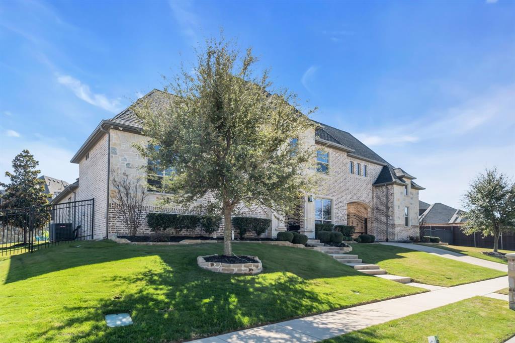 960 Packsaddle Trail Prosper, TX 75078 - Photo 2 of 40 a view of a house with garden and trees