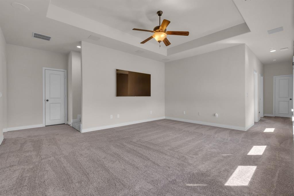 960 Packsaddle Trail Prosper, TX 75078 - Photo 31 of 40 a view of a livingroom with a flat screen tv