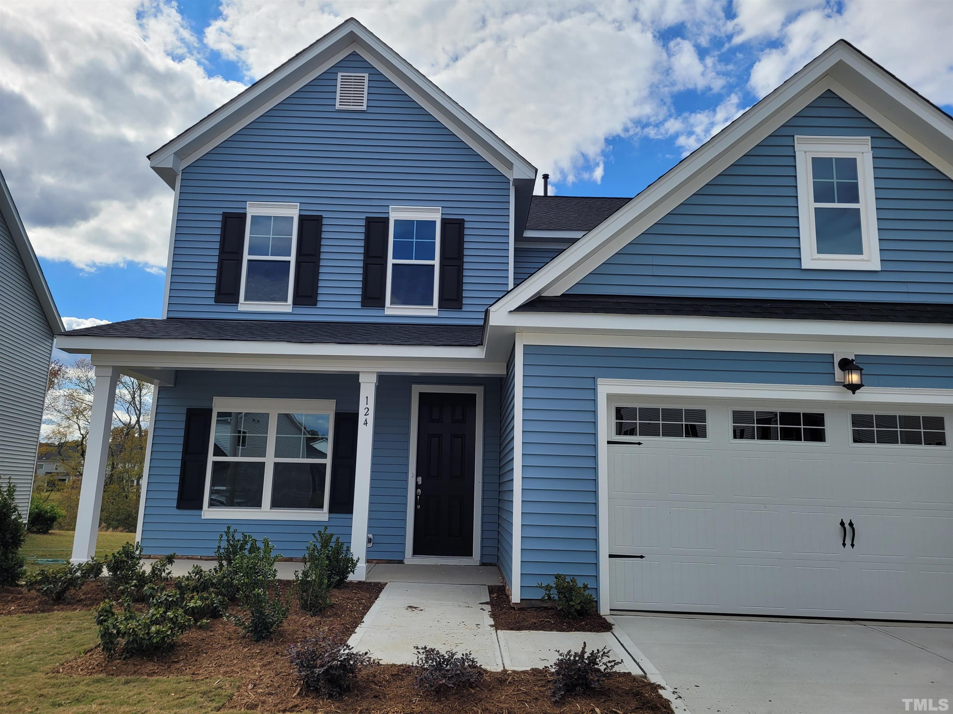 124 Trailing Bluff Way Garner, NC 27529 - Photo 2 of 21 a view of a house with yard