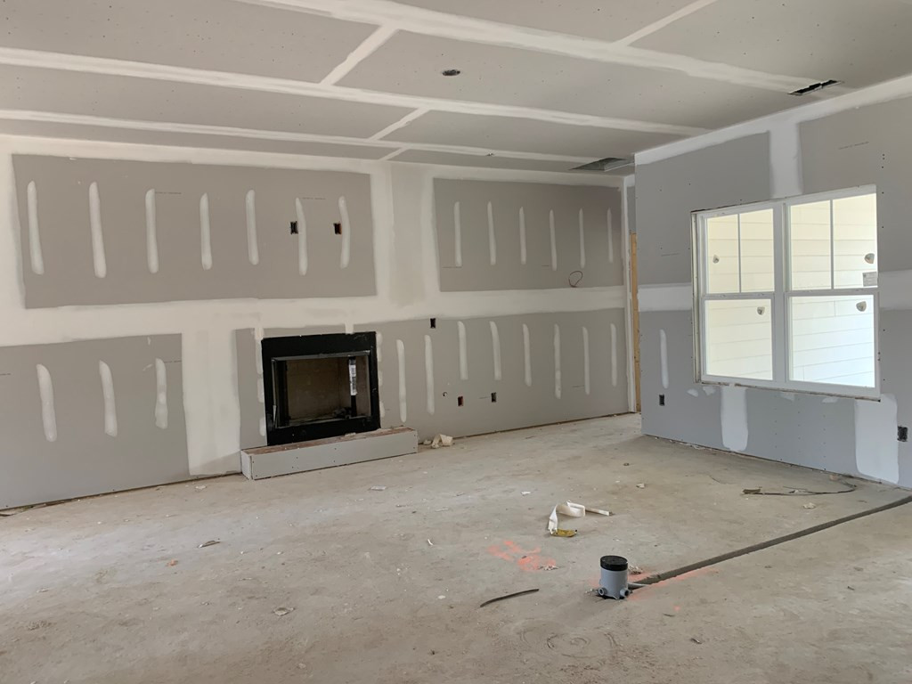 8 Pommel Court Aiken, SC 29803 - Photo 2 of 9 an empty room with windows and fireplace