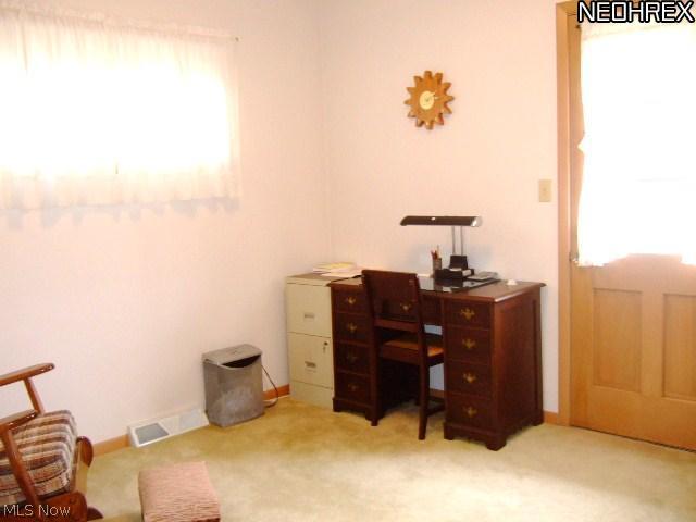 13634 Carpenter Road Garfield Heights, OH 44125 - Photo 13 of 24 Bedroom #3 is currently being used as a home office/den. It has a separate entrance that leads out to the back yard. This would be great for guests or as a teen suite.